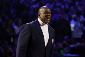 Earvin &quot;Magic&quot; Johnson reacts after being introduced as part of the NBA's 75th Anniversary Team at the All-Star Game on Sunday.