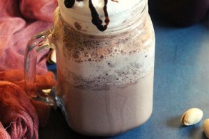 Starbucks double chocolate chip frappe served in a mason jar with choco chips topping