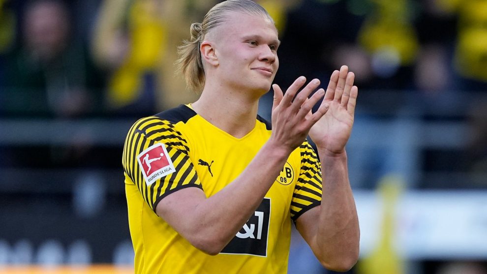 Dortmund's scorer Erling Haaland celebrates after he scored his side's 5th goal during the German Bundesliga soccer match between Borussia Dortmund and VfL Wolfsburg in Dortmund, Germany, Saturday, April 16, 2022. (AP Photo/Martin Meissner)