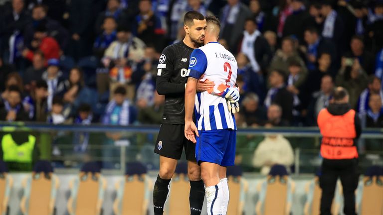 Porto's goalkeeper Diogo Costa embraces team-mate Fabio Cardoso