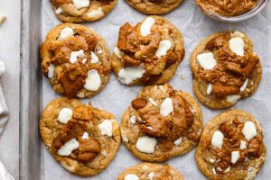 Overhead shot of baked Biscoff cookies on a cookie sheet.