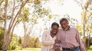 Older couple walking outdoors in a park