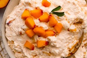 A bowl of peach fluff salad.