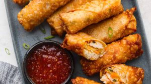 Overhead shot of a plate full of fried shrimp egg rolls.