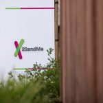 a sign outside 23andMe's office in California, featuring the company's office in the background