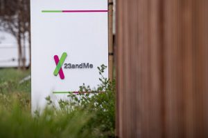 a sign outside 23andMe's office in California, featuring the company's office in the background