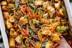 Overhead shot of honey sesame chicken noodle bake.