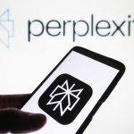 Perplexity AI logo is seen on a smartphone and on a PC screen.